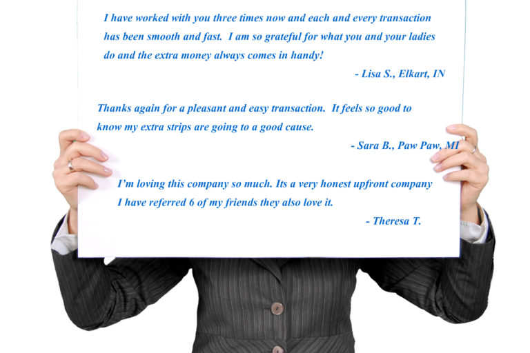 Person holding cardboard with customer reviews printed on it