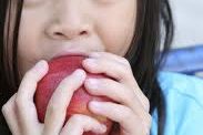 Girl eating an apple
