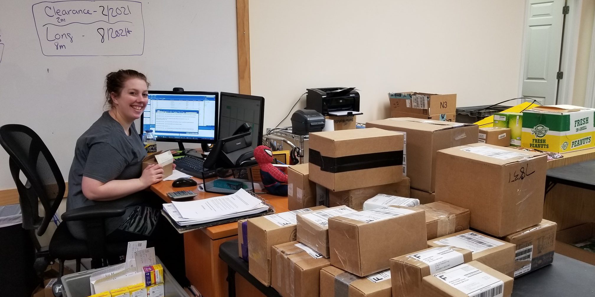 Courtney Buying Diabetic Strips Photograph of young woman working at computer and checking in diabetic test strips